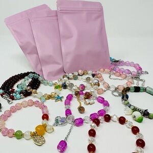 A Mystery bag W 5 Beautiful Hand Made Random Glass Beads and Charm Bracelets